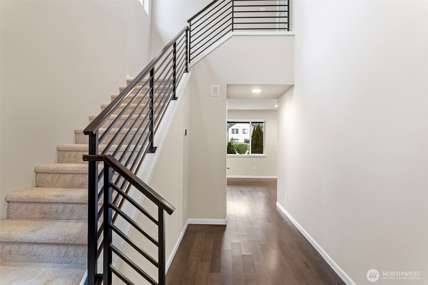 17913 38th Drive Southeast, Unit 20 Bothell, WA 98012 - Photo 2 of 32 a view of a hallway with wooden floor and staircase