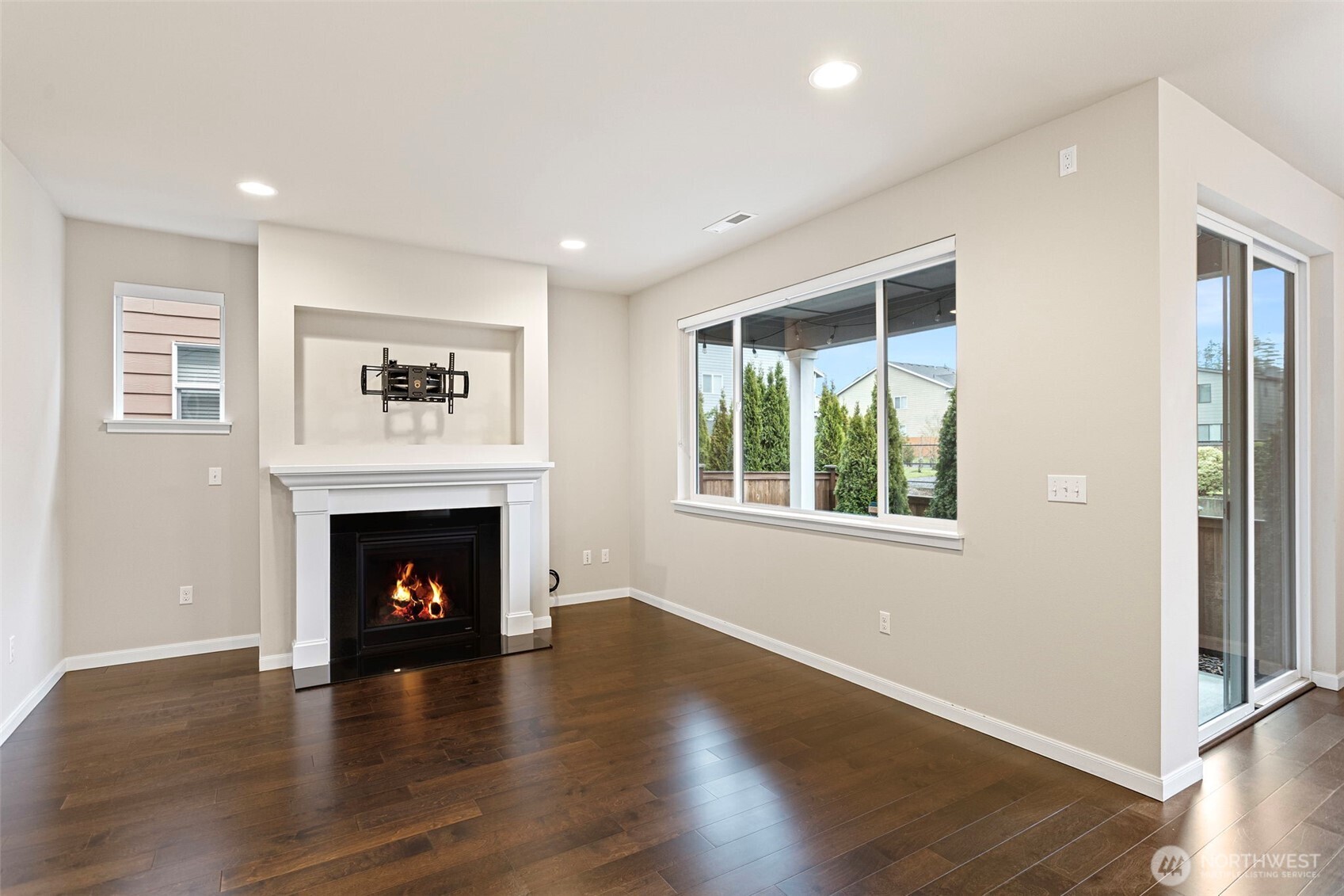 17913 38th Drive Southeast, Unit 20 Bothell, WA 98012 - Photo 4 of 32 a view of an empty room with wooden floor and a window