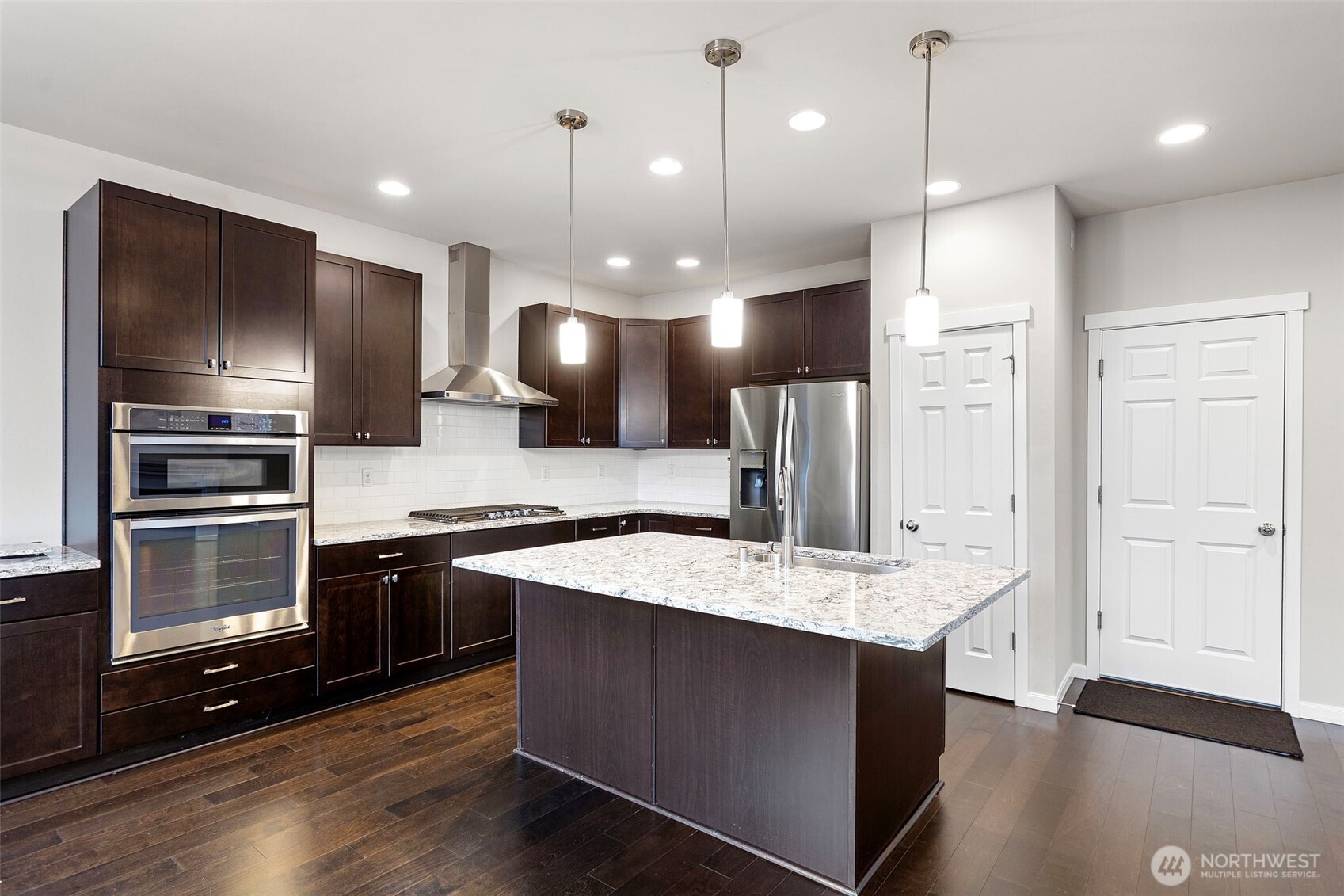 17913 38th Drive Southeast, Unit 20 Bothell, WA 98012 - Photo 10 of 32 a large kitchen with a stove a sink and a refrigerator