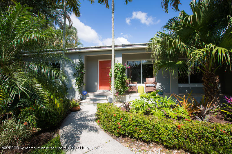 3501 Washington Road West Palm Beach, FL 33405 - Photo 1 of 13 a front view of a house with garden