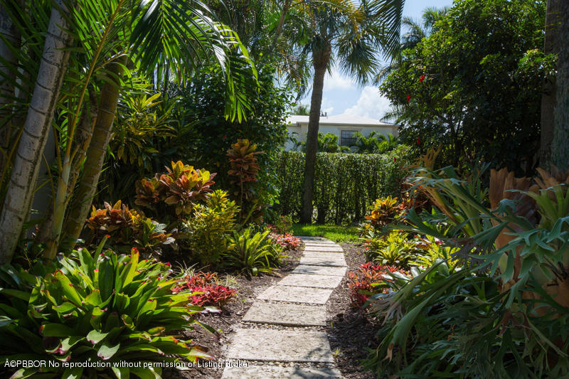 3501 Washington Road West Palm Beach, FL 33405 - Photo 13 of 13 a backyard of a house with a garden and outdoor seating