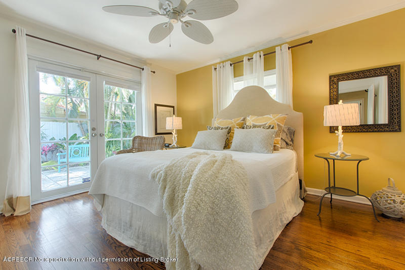 3501 Washington Road West Palm Beach, FL 33405 - Photo 7 of 13 a bedroom with a bed and wooden floor