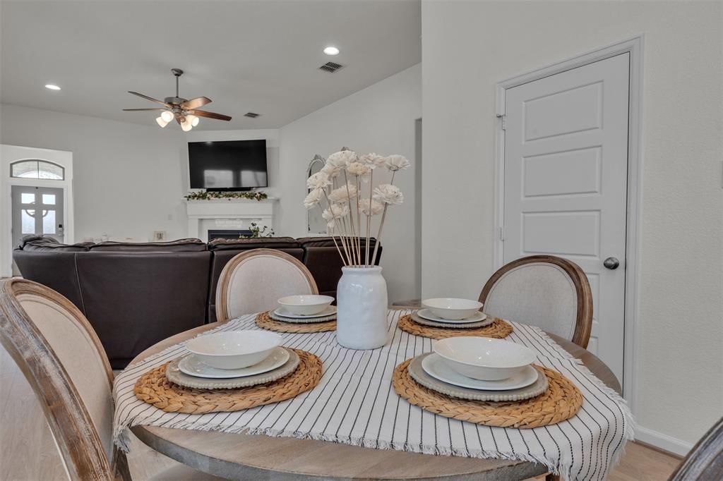 228 Palo Duro Bend Rhome, TX 76078 - Photo 26 of 35 a dining room with furniture and a flat screen tv