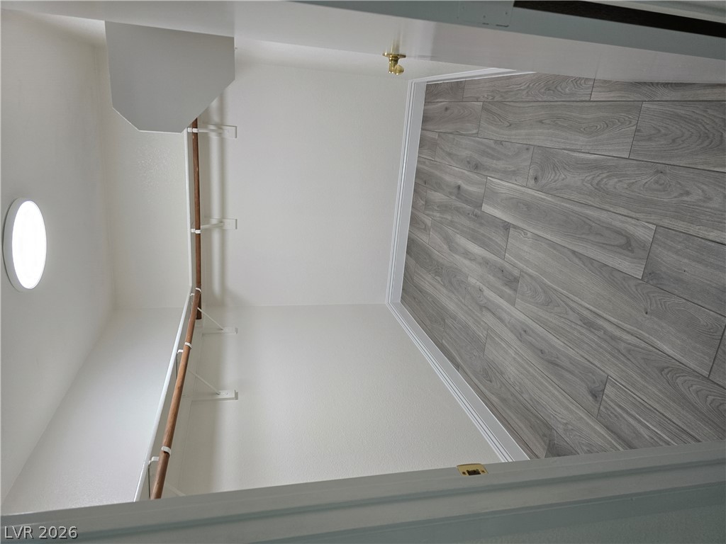 1881 West Alexander Road, Unit 1127 North Las Vegas, NV 89032 - Photo 15 of 20 Walk-in closet features ample storage and modern wood-look flooring.