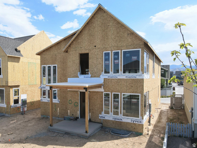 6709 Salt Marsh Road, Unit 448 South Jordan, UT 84009 - Photo 1 of 15 Two-story construction featuring an unfinished exterior and an attached covered patio with wood support beams