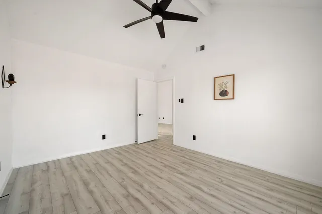 a view of room with wooden floor