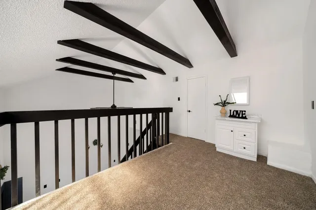 a front view of a house with a garden and plants