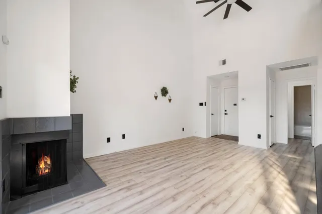 a view of room with hardwood floor and fireplace