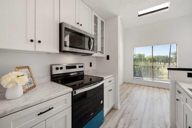 a kitchen with a stove and a microwave