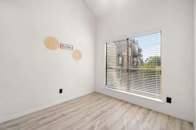 a view of a room that has a window in it