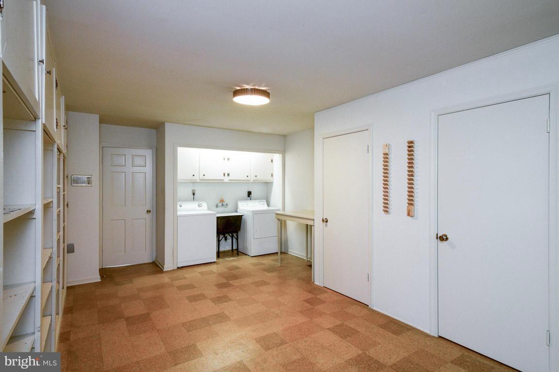 6033 Chesterbrook Road McLean, VA 22101 - Photo 12 of 24 a view of a kitchen with a sink and a refrigerator