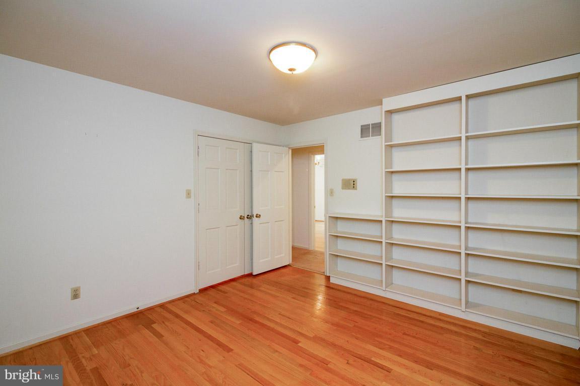 6033 Chesterbrook Road McLean, VA 22101 - Photo 16 of 24 a view of an empty room with wooden floor
