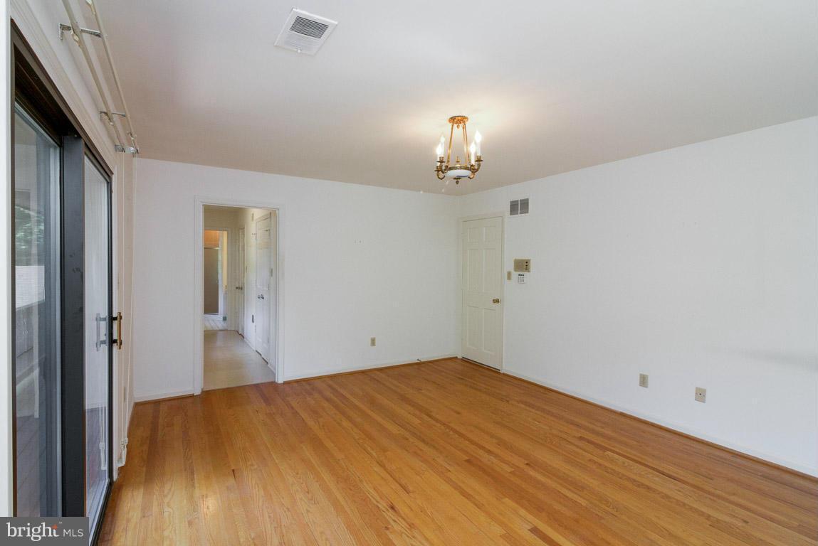 6033 Chesterbrook Road McLean, VA 22101 - Photo 17 of 24 a view of empty room with wooden floor