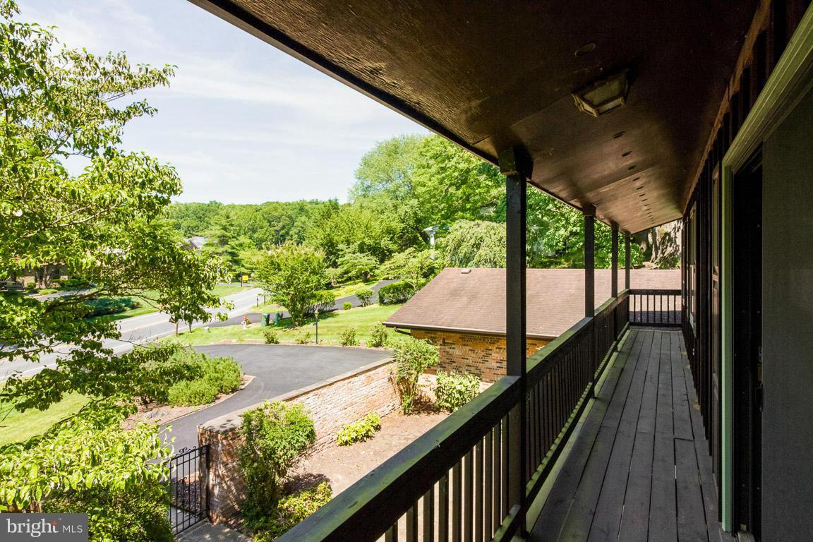 6033 Chesterbrook Road McLean, VA 22101 - Photo 20 of 24 a view of a balcony with wooden floor