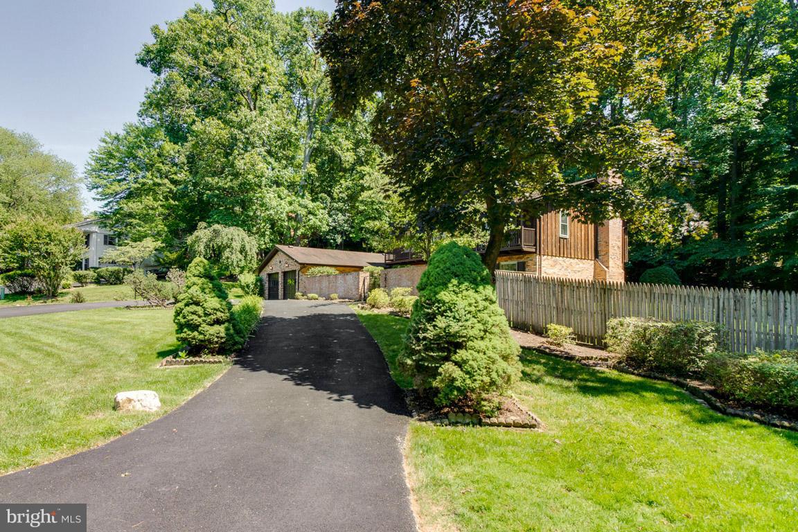 6033 Chesterbrook Road McLean, VA 22101 - Photo 3 of 24 a front view of a house with garden