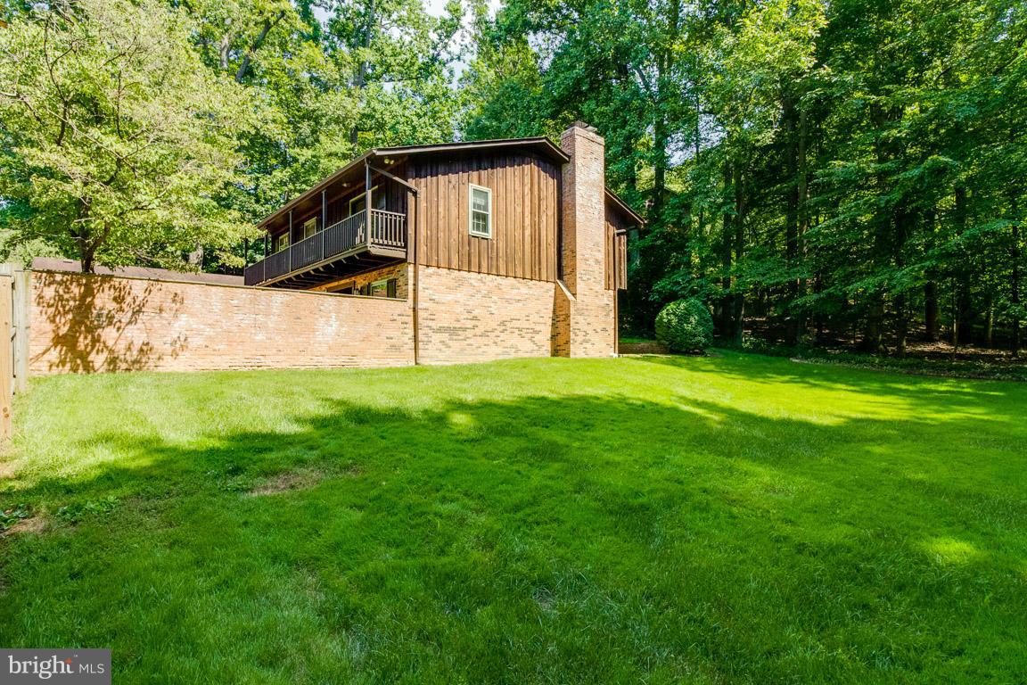 6033 Chesterbrook Road McLean, VA 22101 - Photo 23 of 24 a view of a house with a yard
