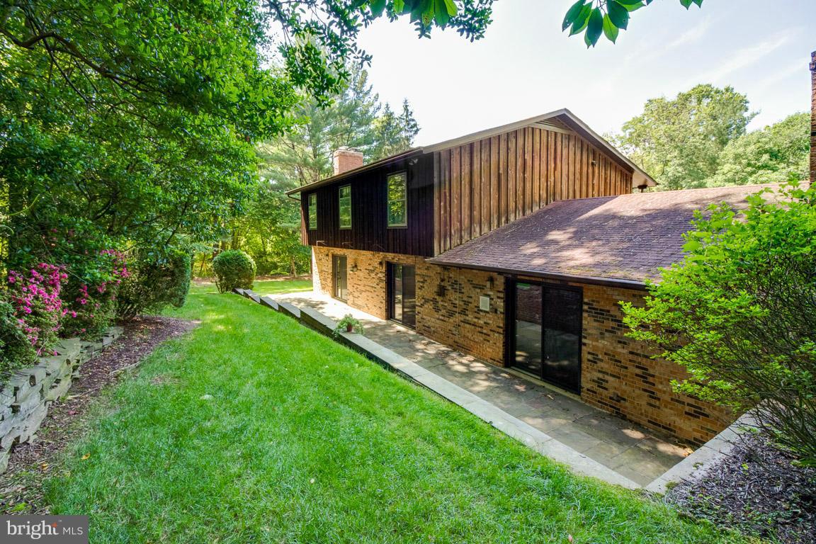 6033 Chesterbrook Road McLean, VA 22101 - Photo 24 of 24 a view of a house with backyard and garden