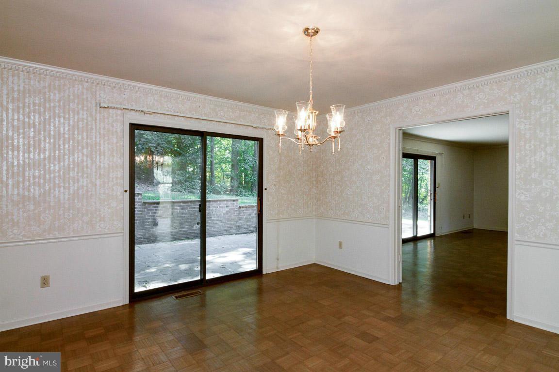 6033 Chesterbrook Road McLean, VA 22101 - Photo 6 of 24 a view of a livingroom with a chandelier