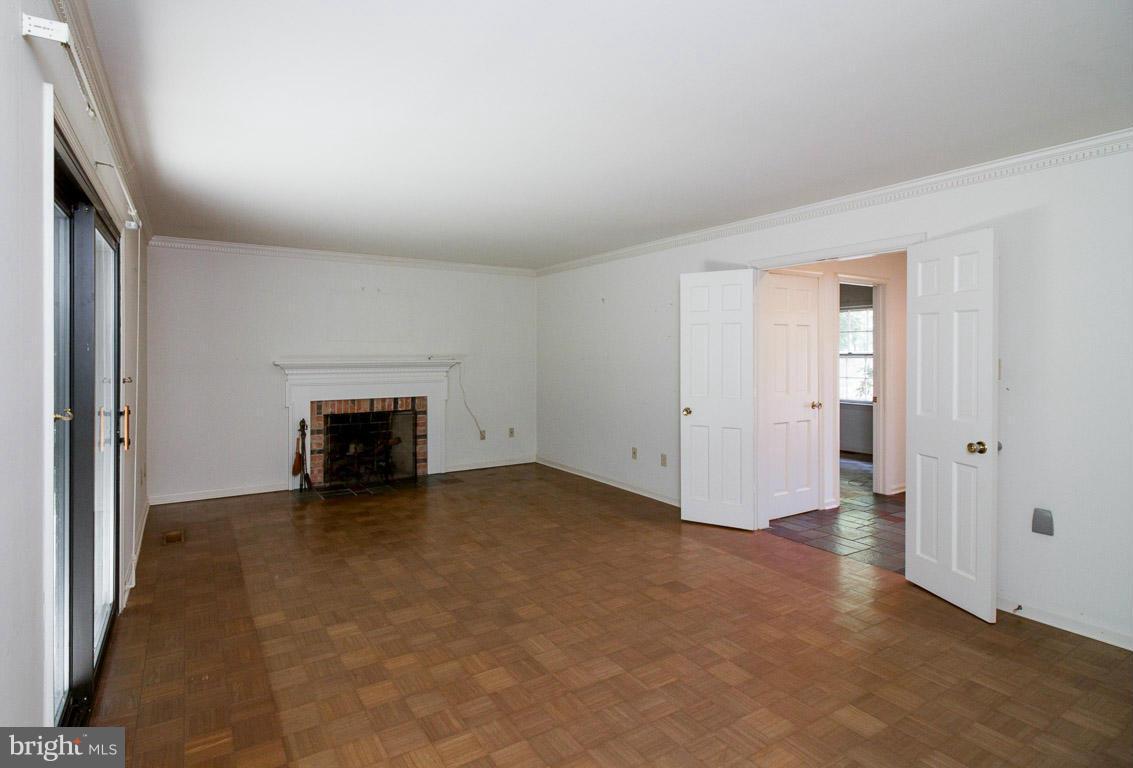 6033 Chesterbrook Road McLean, VA 22101 - Photo 7 of 24 an empty room with fireplace