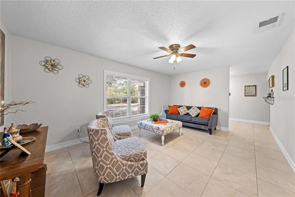 a living room with furniture a bed and a couch