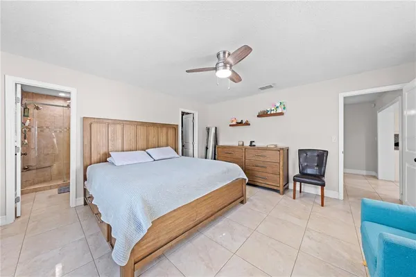 a bed room with a bed and a dresser