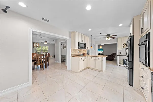 a kitchen with appliances cabinets and a sink
