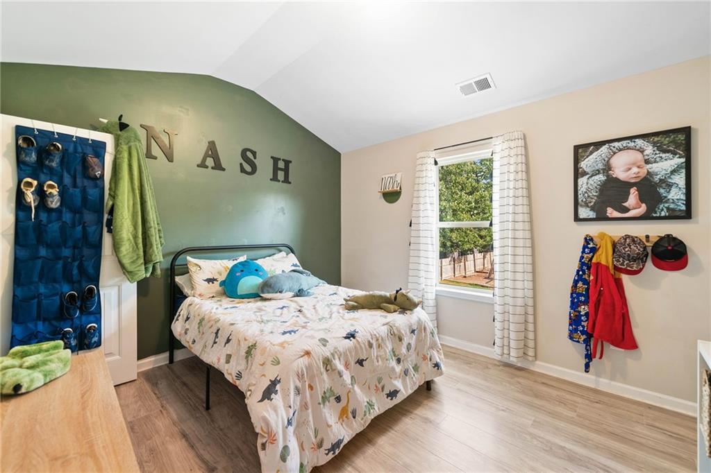 13 Four Feathers Lane Northeast Rydal, GA 30171 - Photo 37 of 51 a bedroom with a bed and a window