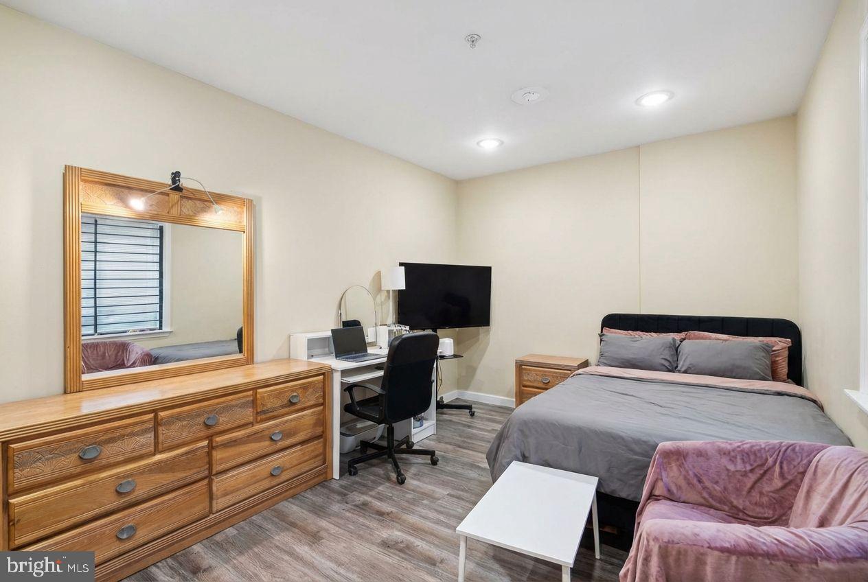 1611 North 17th Street, Unit A Philadelphia, PA 19121 - Photo 13 of 19 a bedroom with a bed and a desk