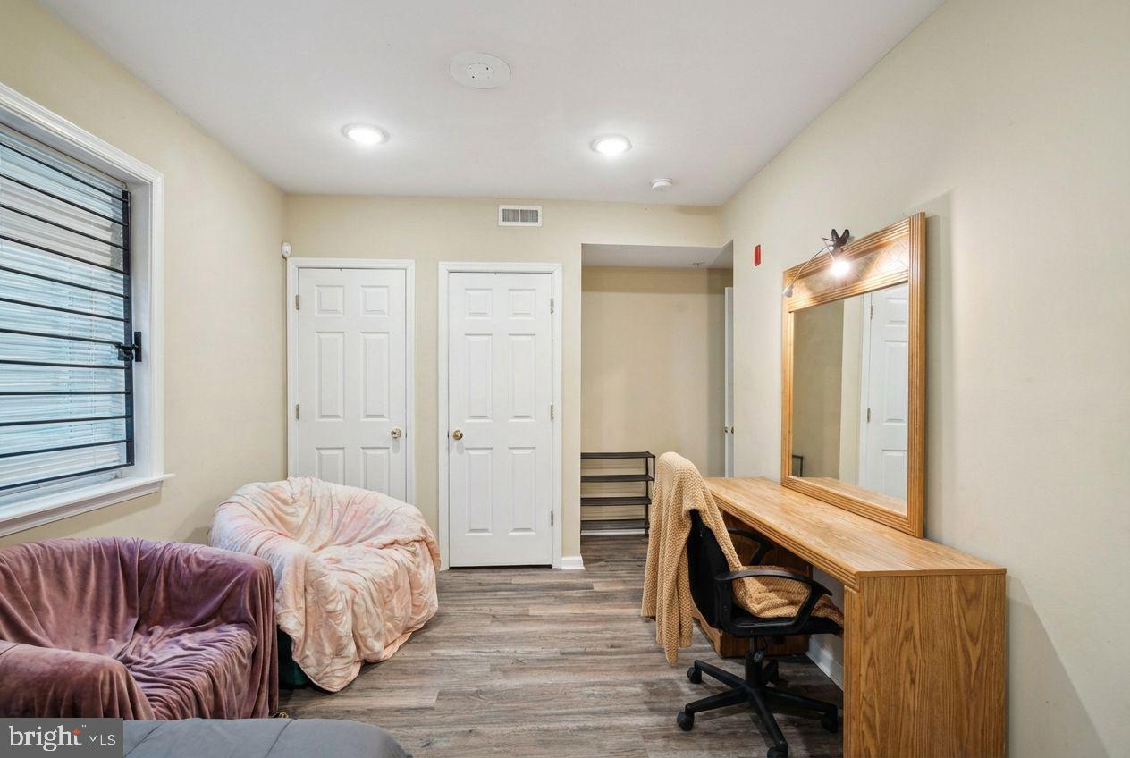 1611 North 17th Street, Unit A Philadelphia, PA 19121 - Photo 14 of 19 a bedroom with a bed and a couch