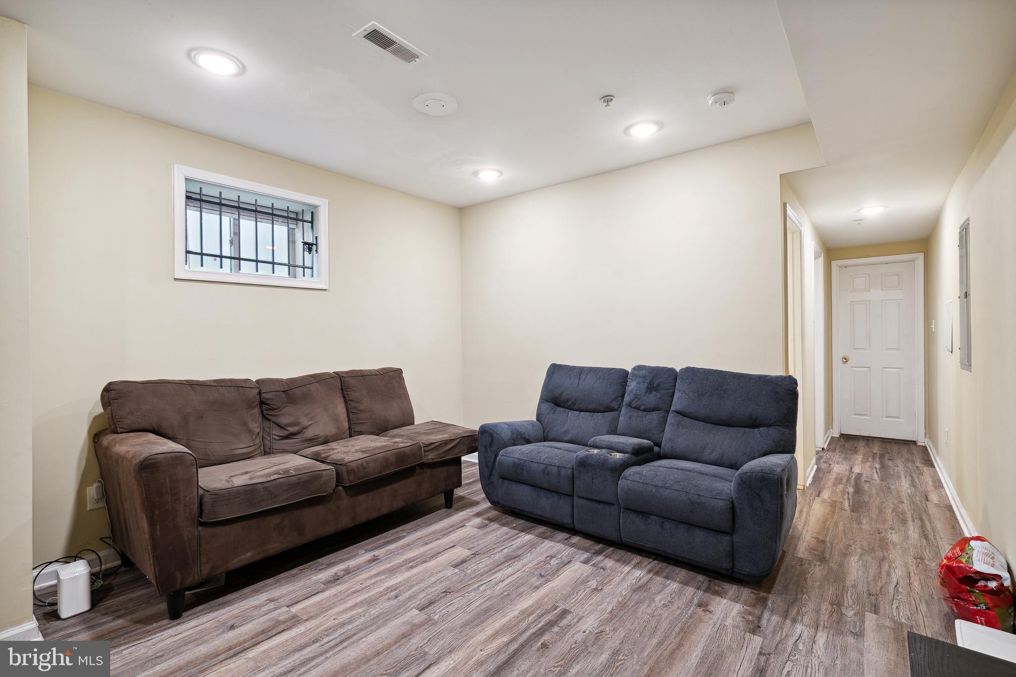 1611 North 17th Street, Unit A Philadelphia, PA 19121 - Photo 5 of 19 a living room with furniture and a couch