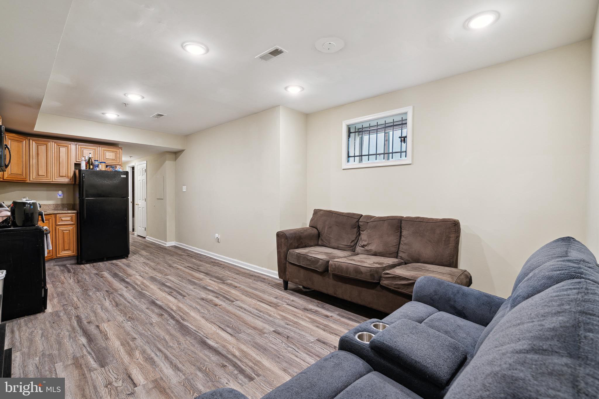 1611 North 17th Street, Unit A Philadelphia, PA 19121 - Photo 6 of 19 a living room with furniture and a couch