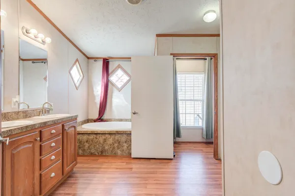 a kitchen with a stove a sink and a refrigerator