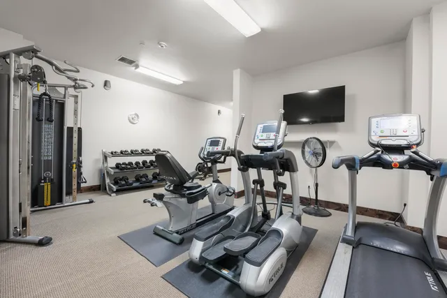 a view of a room with gym equipment