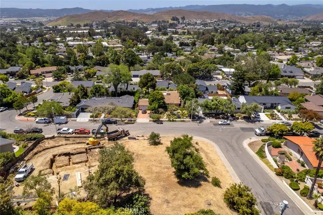 an aerial view of a swimming pool and mountain view