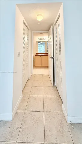 a view of empty room with a fireplace