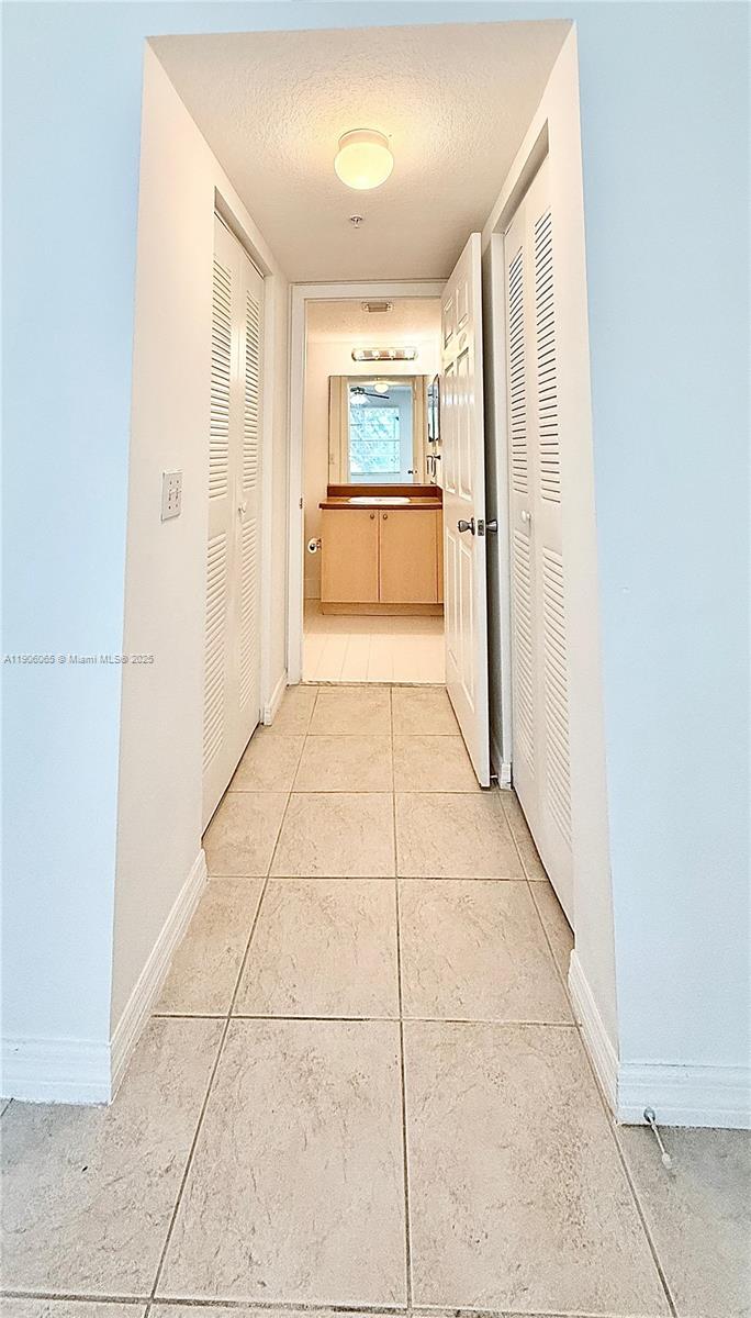 4211 San Marino Boulevard, Unit 205 West Palm Beach, FL 33409 - Photo 12 of 22 a view of empty room with a fireplace