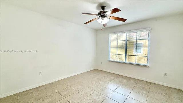 a car parked in front of a white house