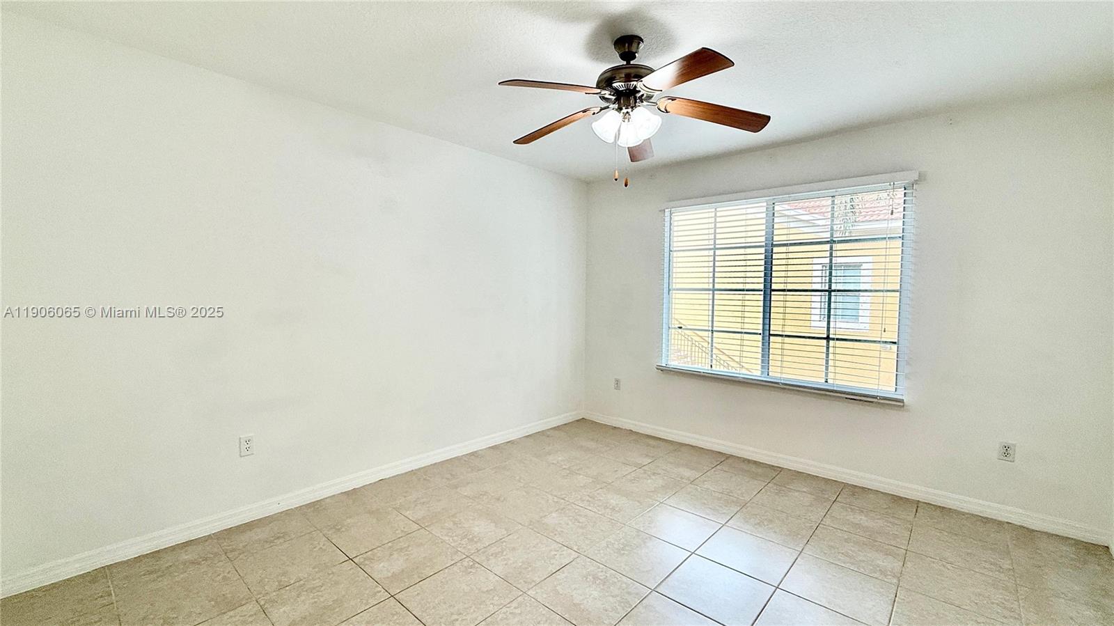 4211 San Marino Boulevard, Unit 205 West Palm Beach, FL 33409 - Photo 20 of 22 a view of a big room with windows and chandelier fan