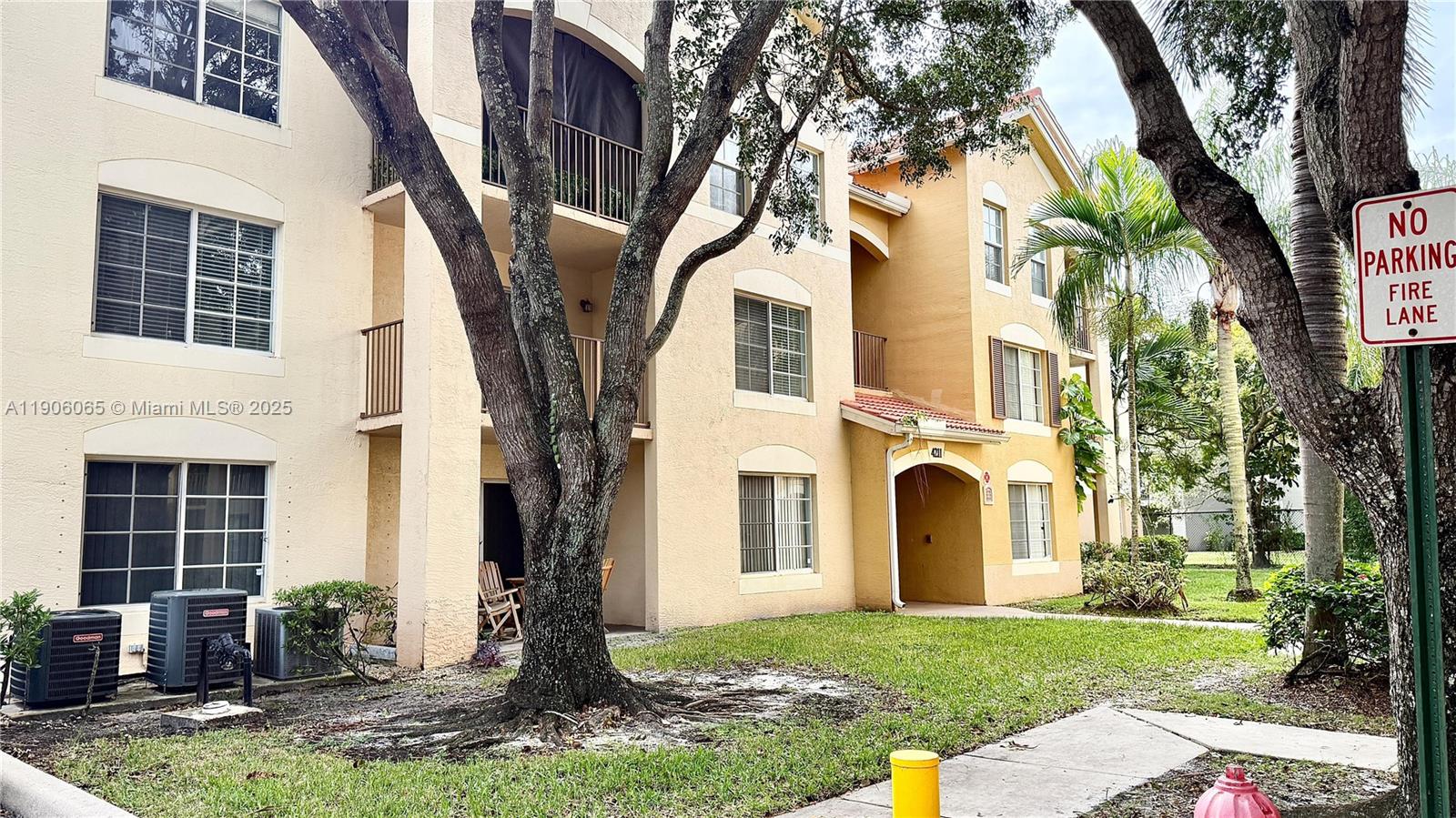 4211 San Marino Boulevard, Unit 205 West Palm Beach, FL 33409 - Photo 22 of 22 a front view of a house with garden