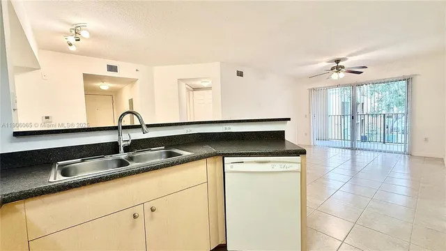 a kitchen with a sink and a stove
