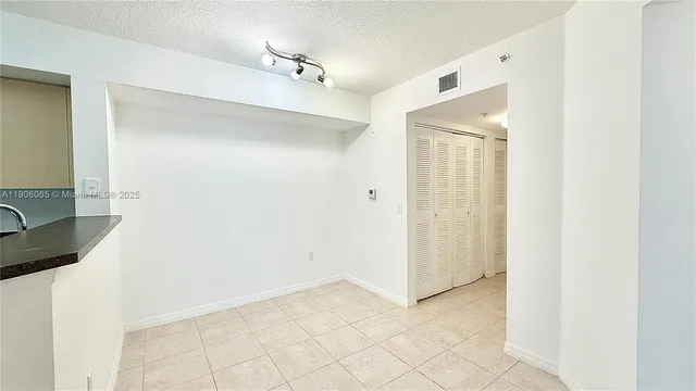 a view of a bathroom with a sink and a mirror