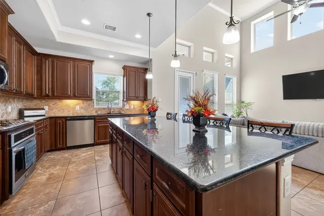 a living room with couches and furniture with wooden floor