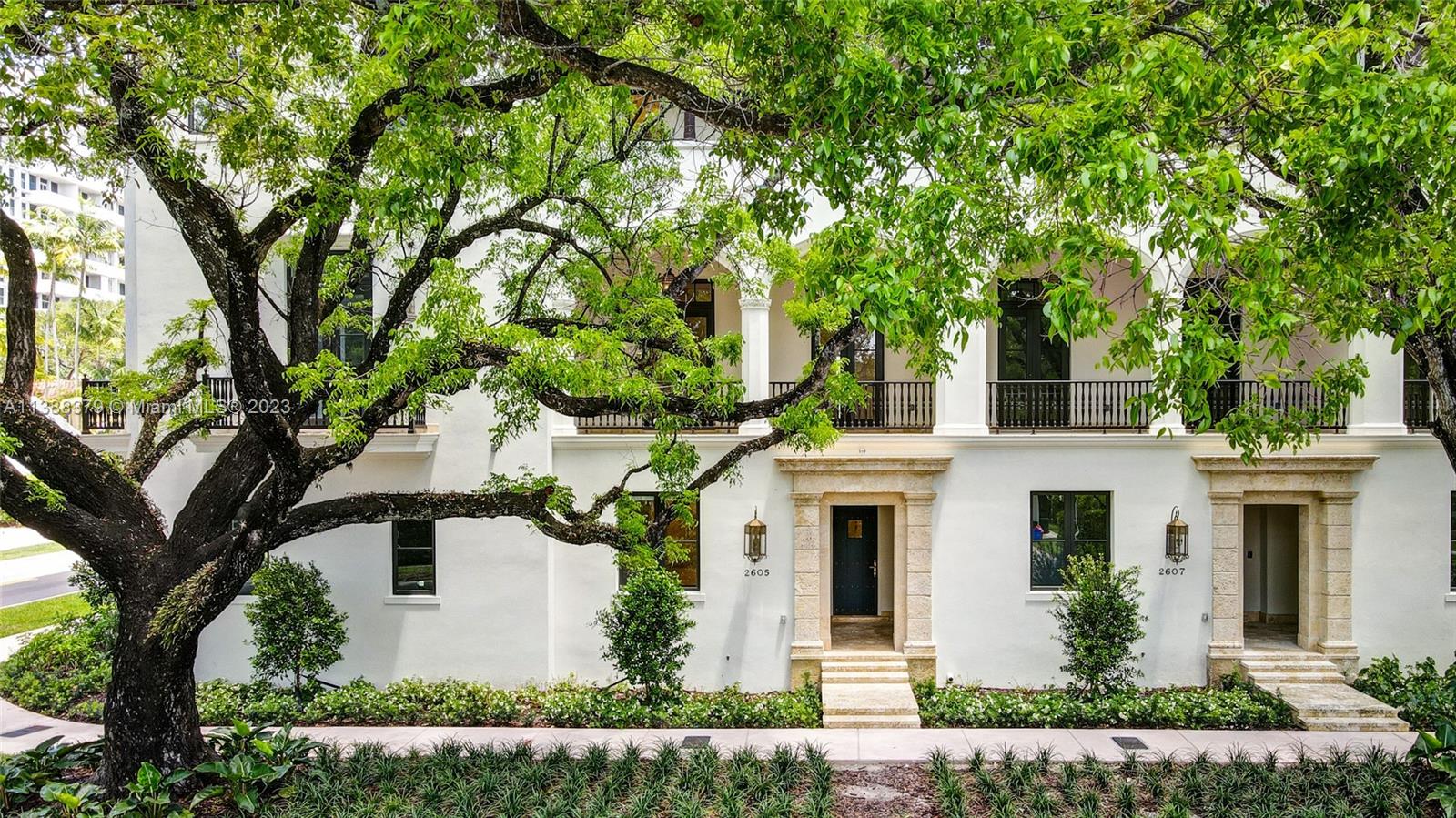 2607 Anderson Road Coral Gables, FL 33134 - Photo 3 of 96 a front view of a house with a garden