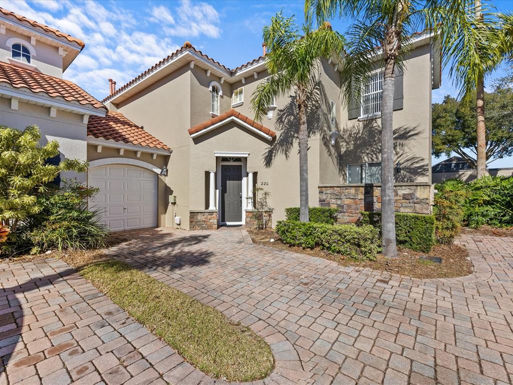 220 Brunello Drive Davenport, FL 33897 - Photo 1 of 1 a front view of a house with garden