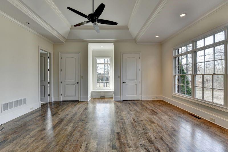 4045 Ridge Road Buford, GA 30519 - Photo 32 of 97 a view of an empty room with a window and wooden floor