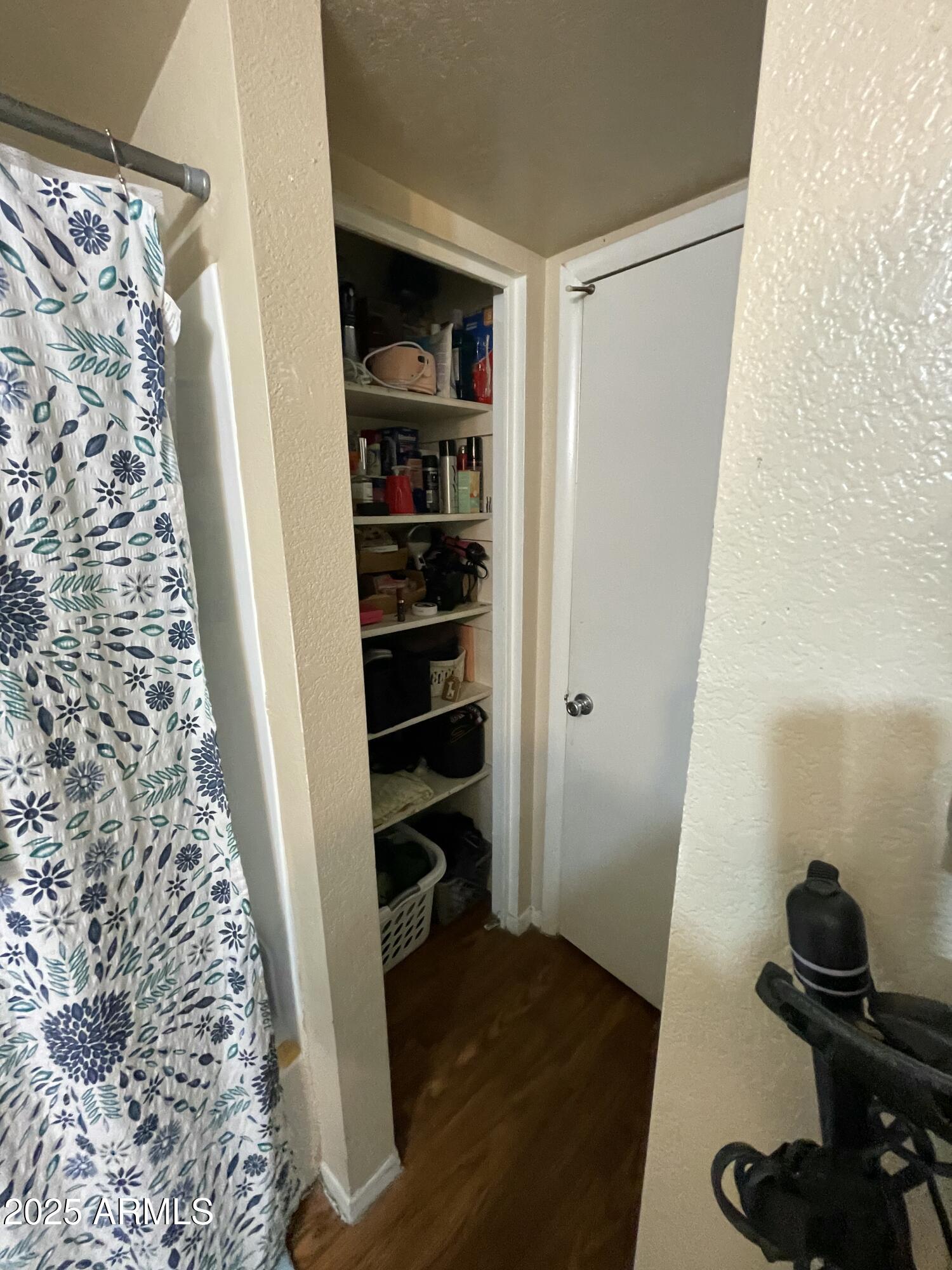 2822 East Kathleen Road Phoenix, AZ 85032 - Photo 7 of 30 a view of walk in closet with clothes and shoes