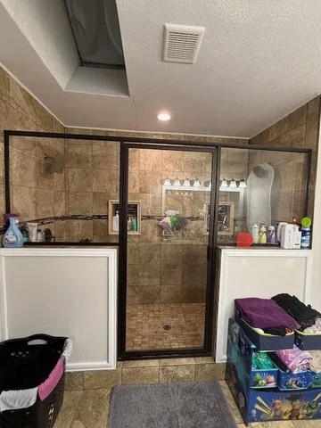 a bathroom with a sink and a shower