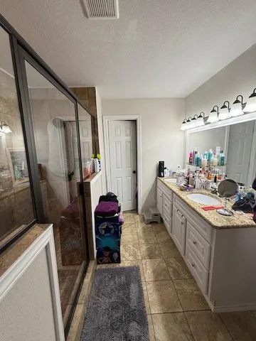 a kitchen with sink cabinets and appliances