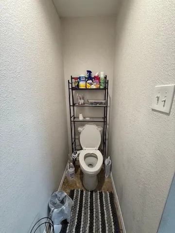 a bathroom with a toilet and a sink