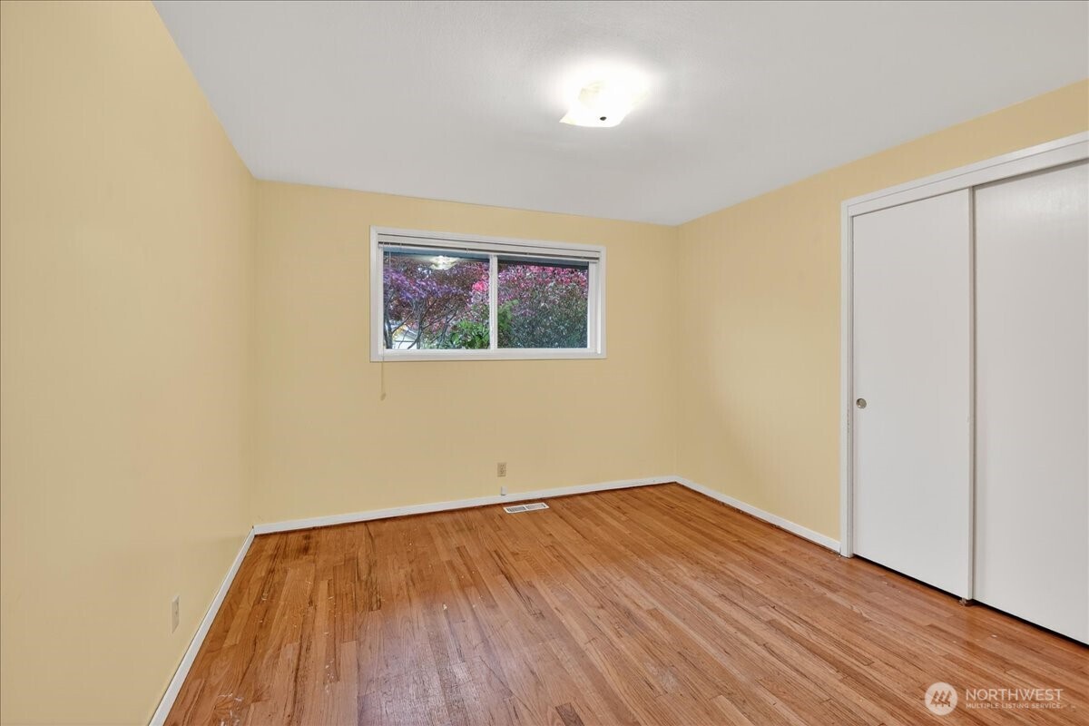 20721 81st Avenue West Edmonds, WA 98026 - Photo 14 of 25 an empty room with wooden floor and a window